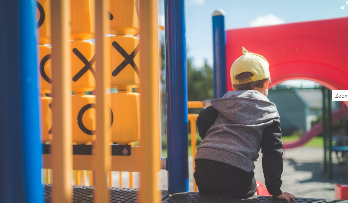 An image of a child on a playground to represent play in austerity discussed in this journal article co-authored by Professor Sarah Mills