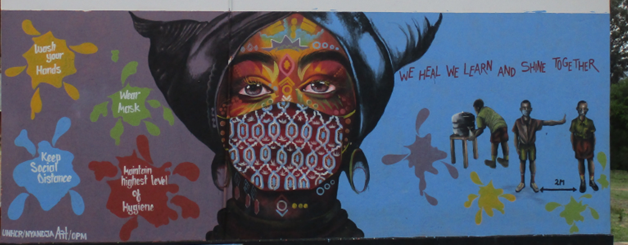 A mural at a refugee settlement in Uganda of a woman wearing a facemask for COVID-19, featured in a journal article led by Professor Sarah Mills