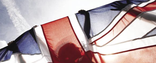 A policy document front cover of a young person holding a Union Flag, focused on National Citizen Service - a youth programme discussed in this journal article led by Professor Sarah Mills