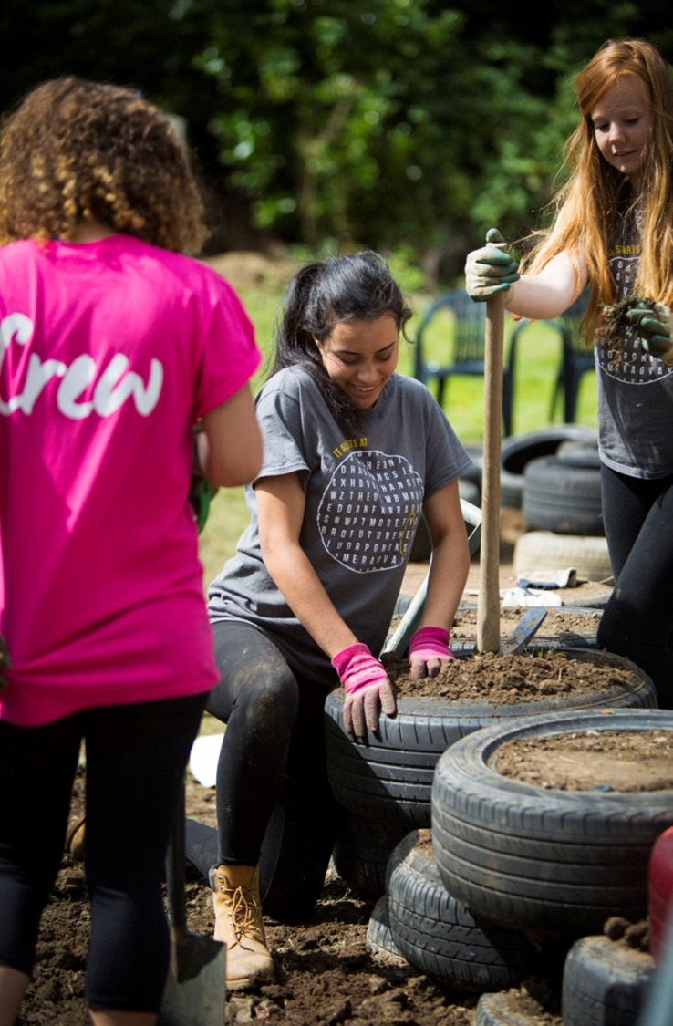 A photo of 3 young people volunteering as part of National Citizen Service, a programme by UK Government that Prof. Mills researched via an ESRC FRL award
