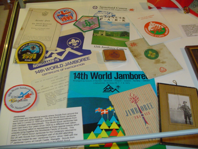 Display cabinet of World Scout Jamboree items as part of the centenary exhibition of scouting, Ceredigion Museum, curated by Professor Sarah Mills