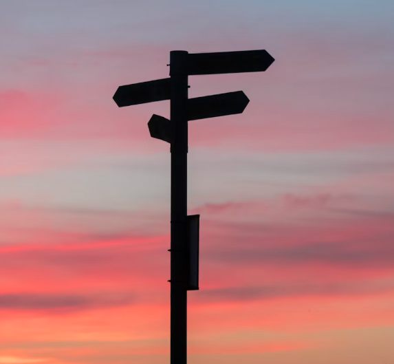 An image of a signpost with different directions on to represent 'divergent geographies of policy and practice' examined in this journal article co-authored by Professor Sarah Mills