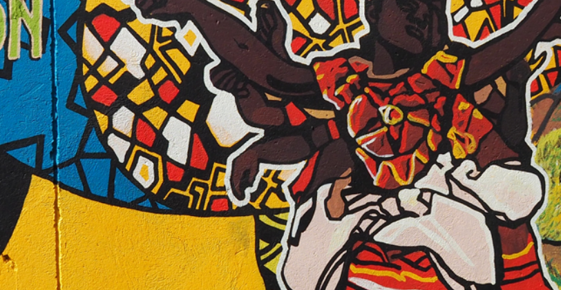 A wall mural in Uganda, representing this journal article co-authored by Professor Sarah Mills